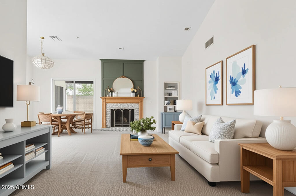 a living room with furniture a fireplace and a flat screen tv