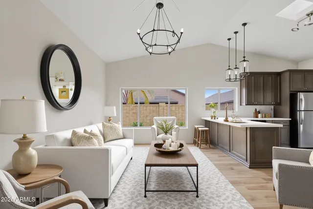 a view of kitchen with stainless steel appliances granite countertop a stove a sink dishwasher and a refrigerator with wooden floor