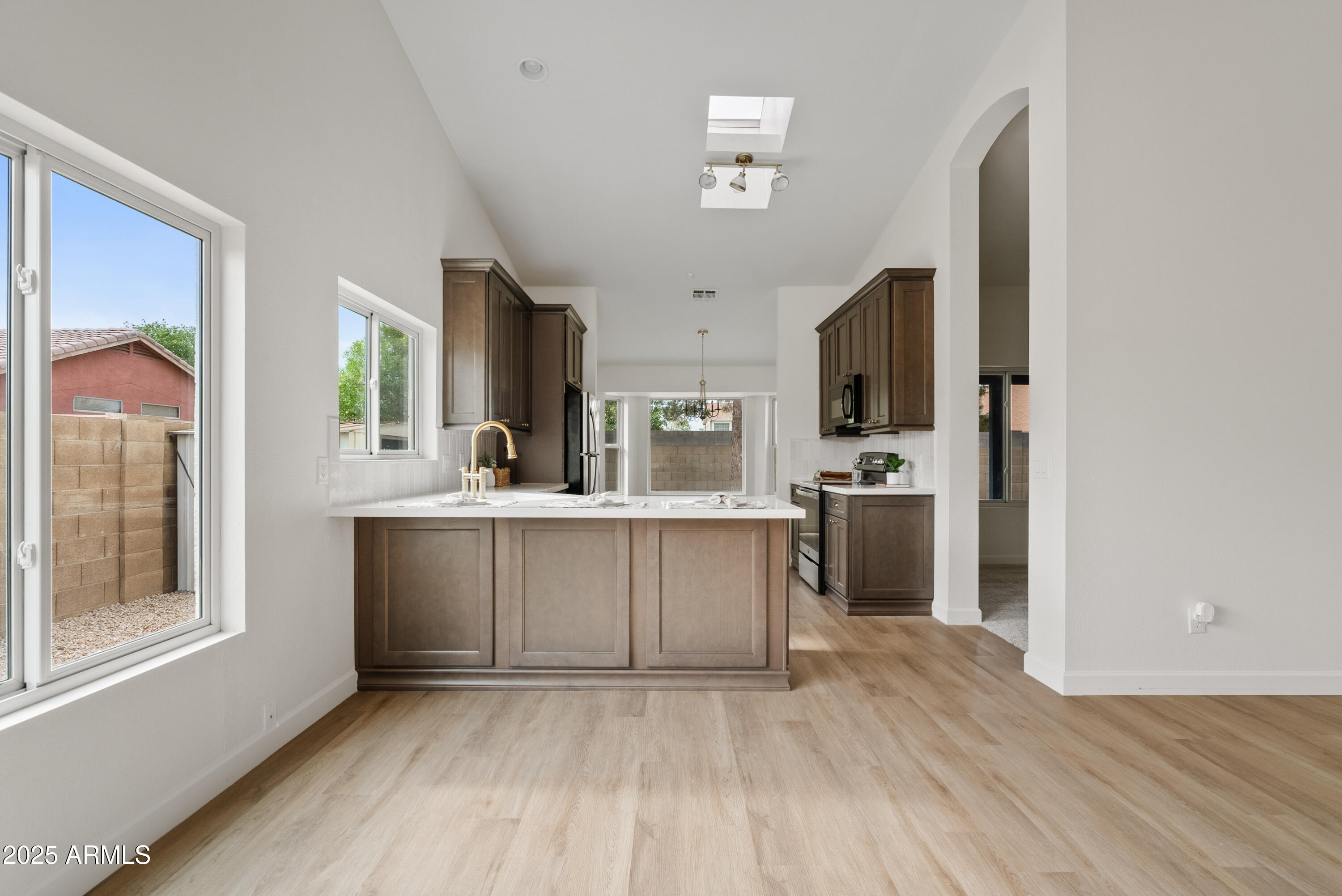 550 East Appaloosa Road Gilbert, AZ 85296 - Photo 11 of 41 a kitchen with a refrigerator and a sink