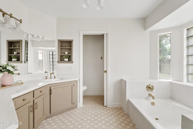 a view of a kitchen with a sink and a fireplace
