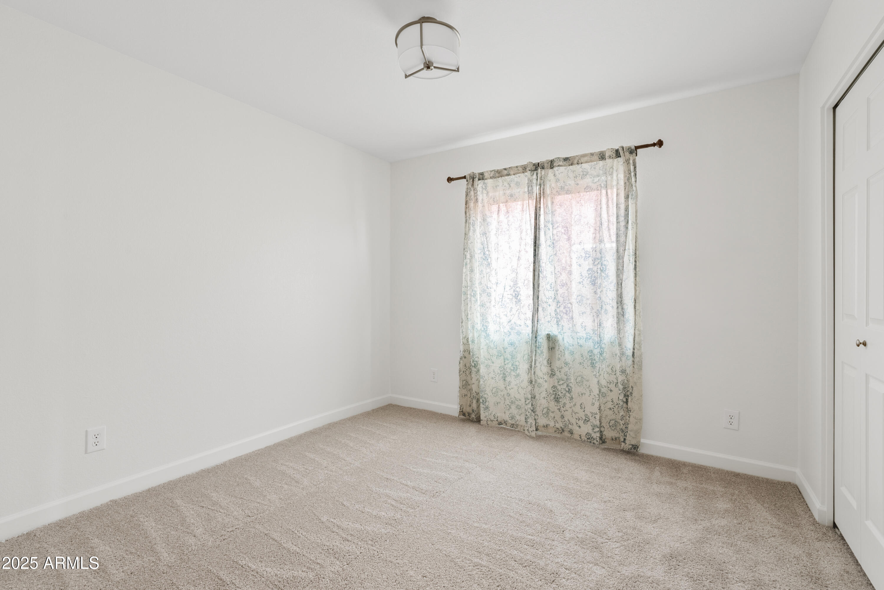 550 East Appaloosa Road Gilbert, AZ 85296 - Photo 31 of 41 a view of an empty room with a window