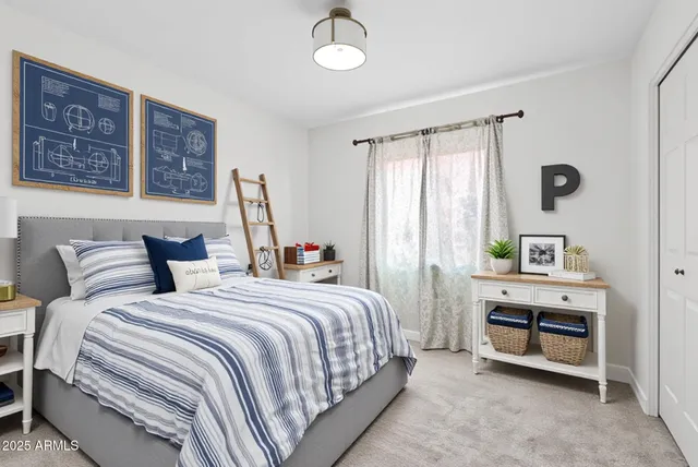 a bedroom with bed and window