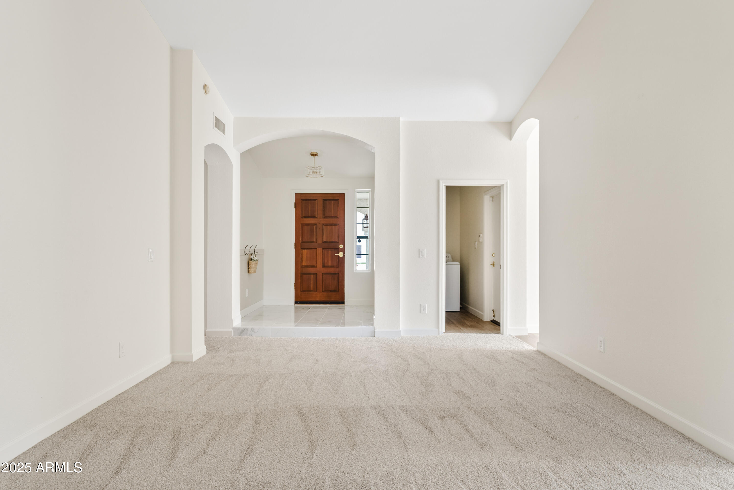 550 East Appaloosa Road Gilbert, AZ 85296 - Photo 5 of 41 a view of a hallway with wooden shelves