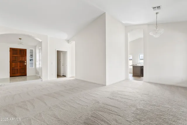 a view of a hallway with wooden shelves