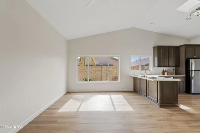 a view of a room with wooden floor