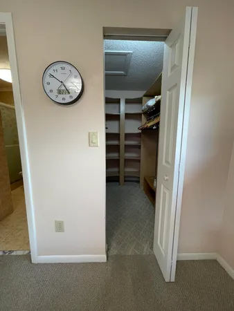 an empty room with a walk in closet