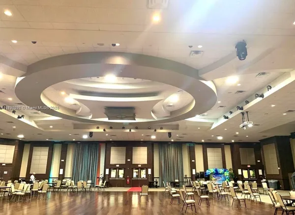 a view of a room with lots of gym equipment