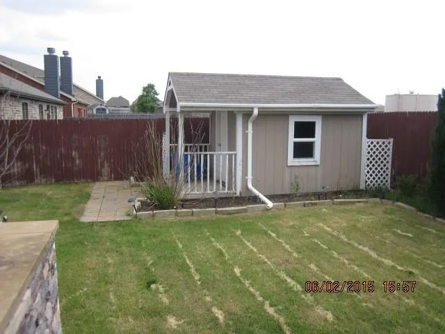 a view of a house with a yard and a garage