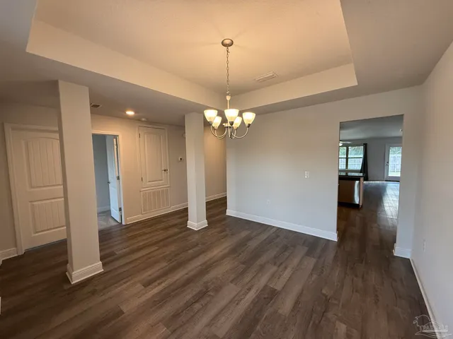 a view of a livingroom with wooden floor