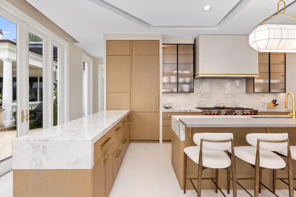 a bathroom with a granite countertop sink a toilet and a shower