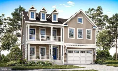 an aerial view of a houses with a yard