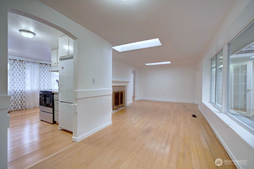 15520 30th Avenue Northeast Shoreline, WA 98155 - Photo 14 of 17 a view of kitchen with furniture and wooden floor