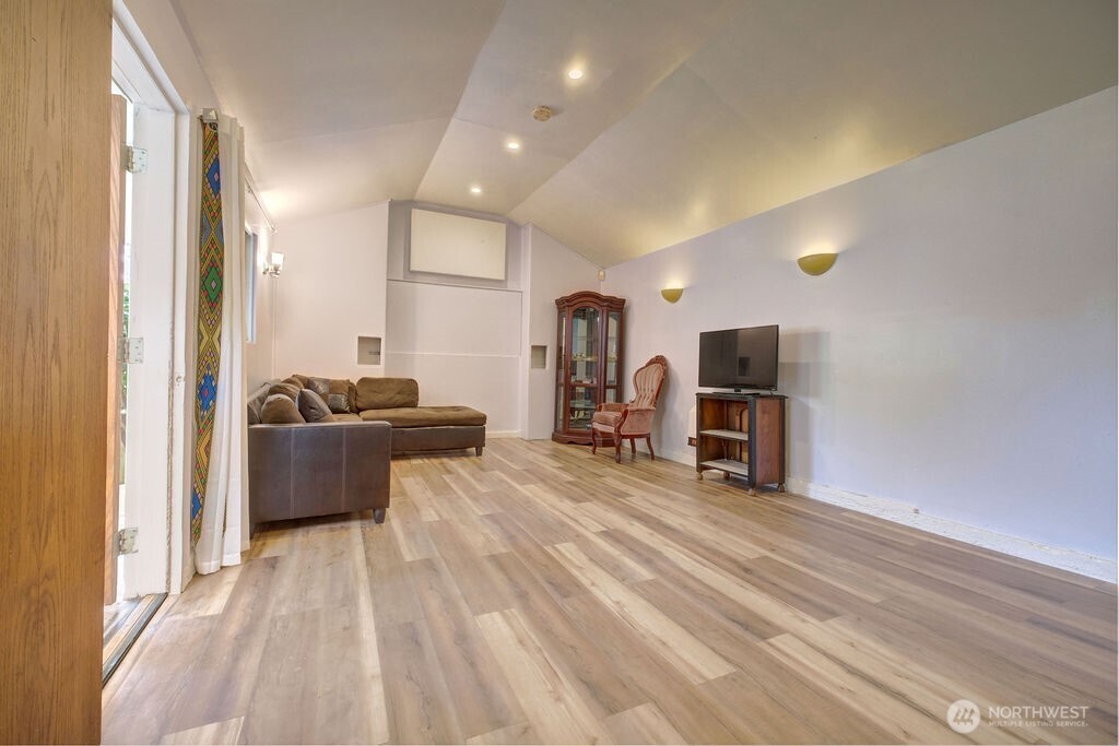 15520 30th Avenue Northeast Shoreline, WA 98155 - Photo 15 of 17 a living room with furniture and a flat screen tv