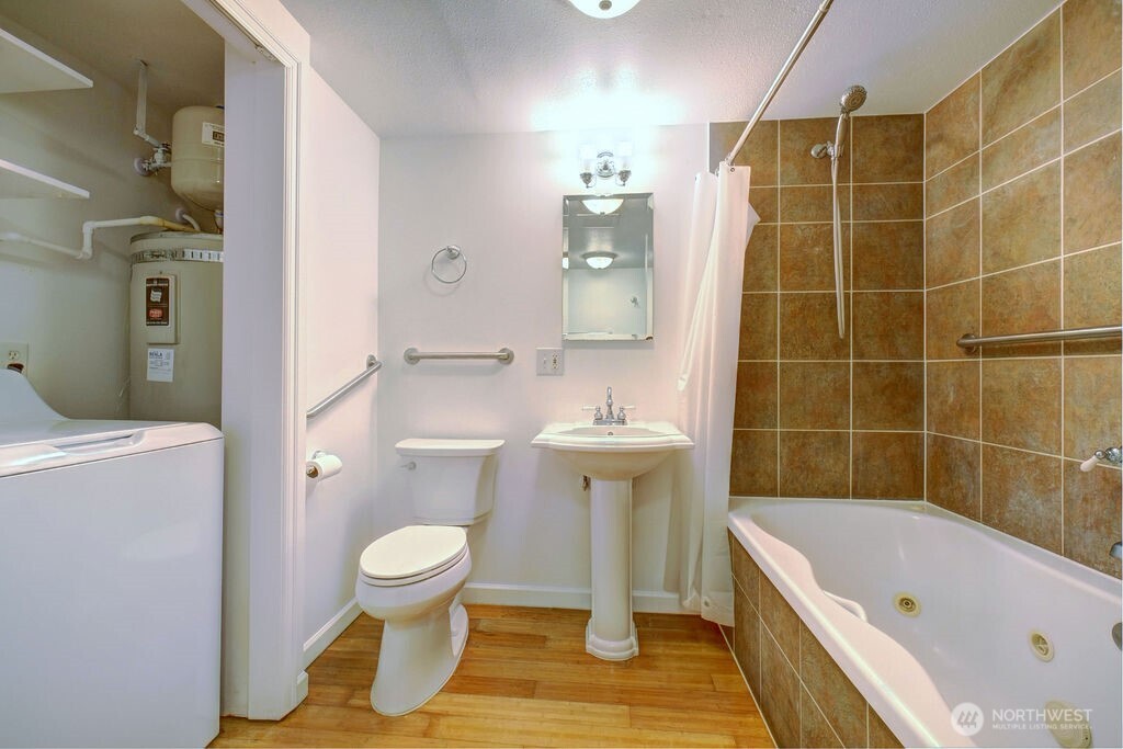 15520 30th Avenue Northeast Shoreline, WA 98155 - Photo 10 of 17 a bathroom with a sink toilet and shower