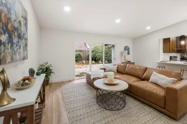 a bathroom with a sink mirror and toilet