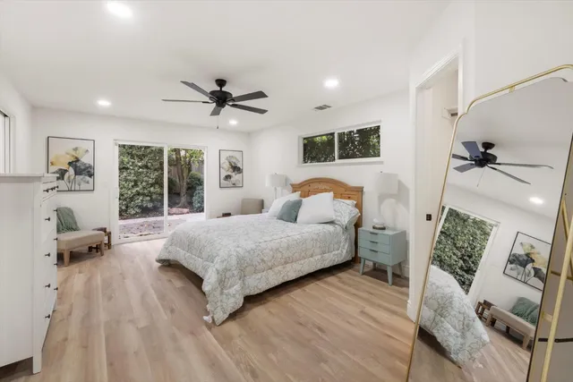 a bedroom with a bed and a couch