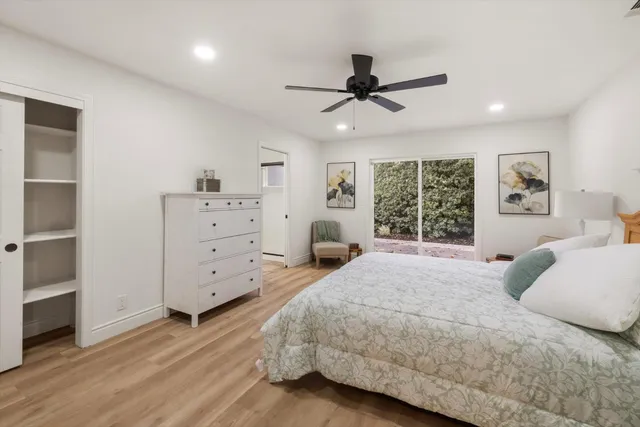 a bathroom with a glass door shower a sink and a mirror
