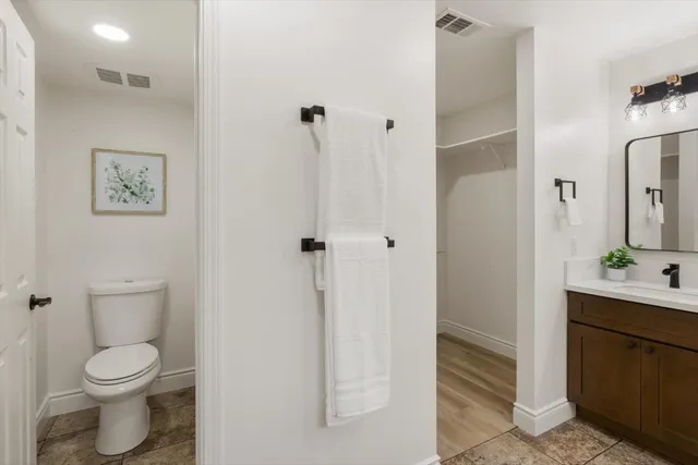 a view of a room with wooden floor