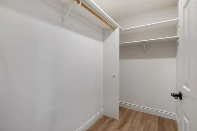 a work room with furniture and a window