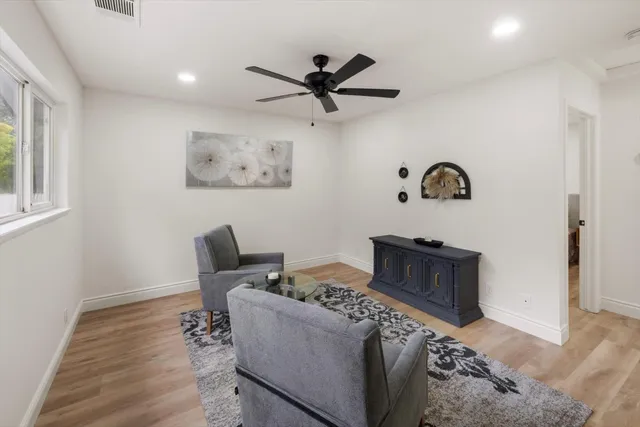 a bed room with a bed and a chair