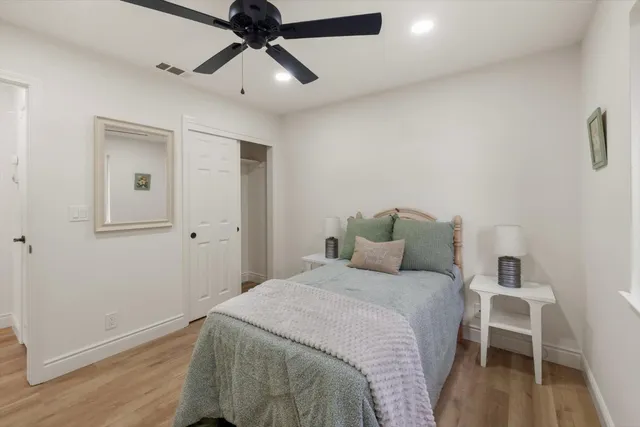 a bathroom with a double vanity sink mirror and shower