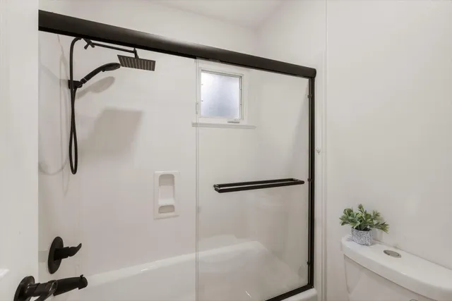 a view of backyard of house with green space