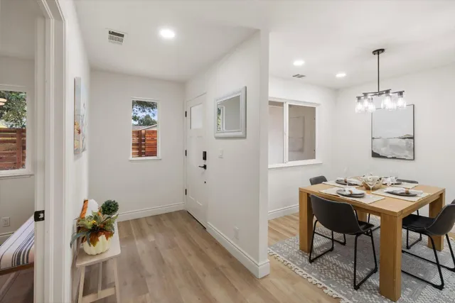 a view of a dining room that has a table and chairs