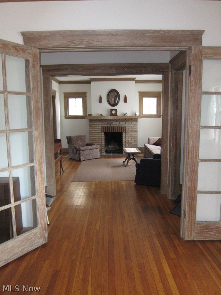1808 Radnor Road Cleveland, OH 44118 - Photo 3 of 24 Looking into the Living Room from the Family Room. Note the French doors and feature fireplace.