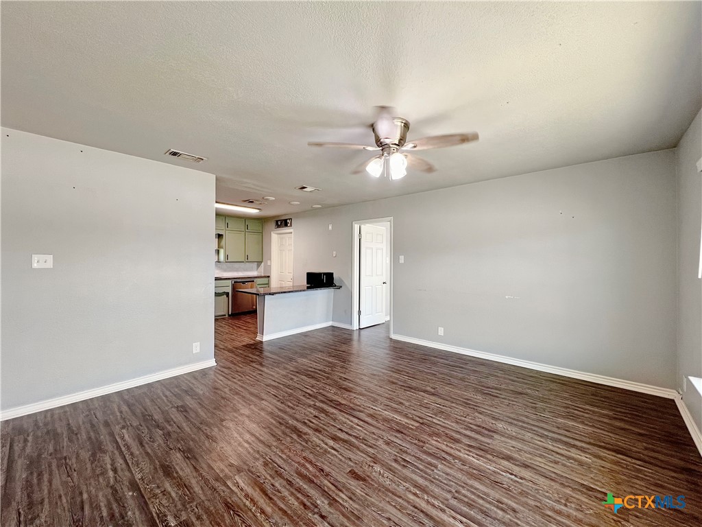 1311 West Main Street Gatesville, TX 76528 - Photo 12 of 30 a view of empty room with wooden floor