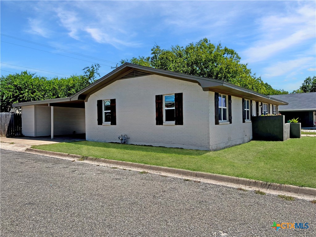 1311 West Main Street Gatesville, TX 76528 - Photo 5 of 30 a view of a house with backyard and garden