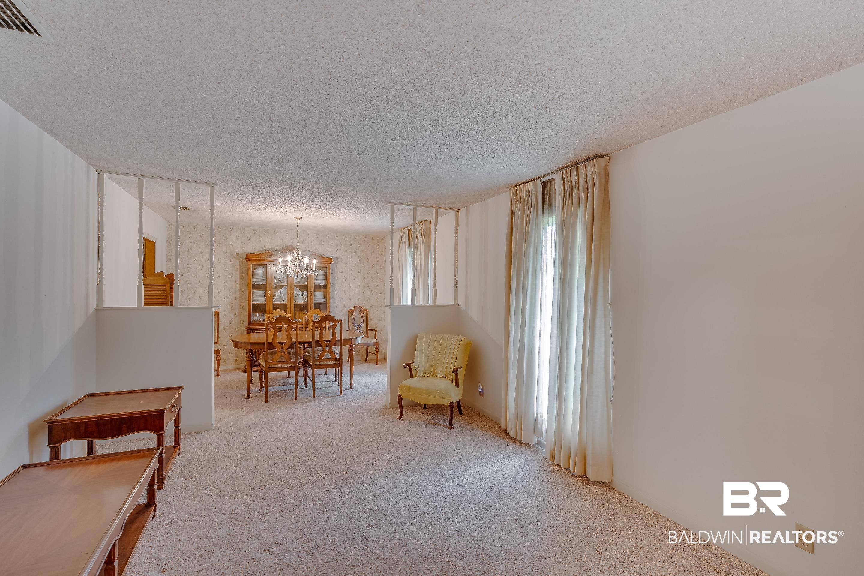 5151 McCrary Road Semmes, AL 36575 - Photo 44 of 62 Sitting room featuring carpet flooring, a chandelier, and a textured ceiling