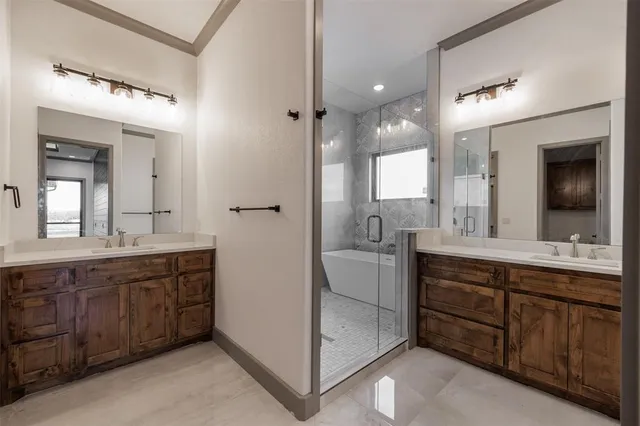 a bathroom with a double vanity sink mirror and double