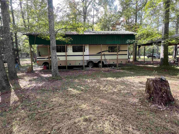 a view of a house with a back yard
