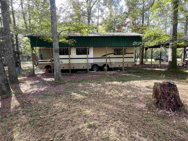 a view of a house with a back yard