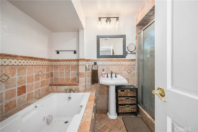 a spacious bedroom with a bed and a large window