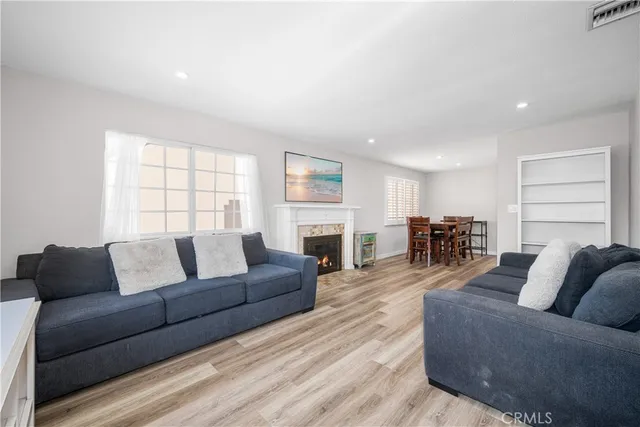 a pathway of a brick house with a door