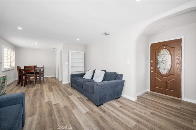 a living room with furniture fireplace and window