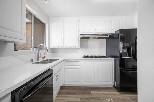 a view of a dining room with furniture and window