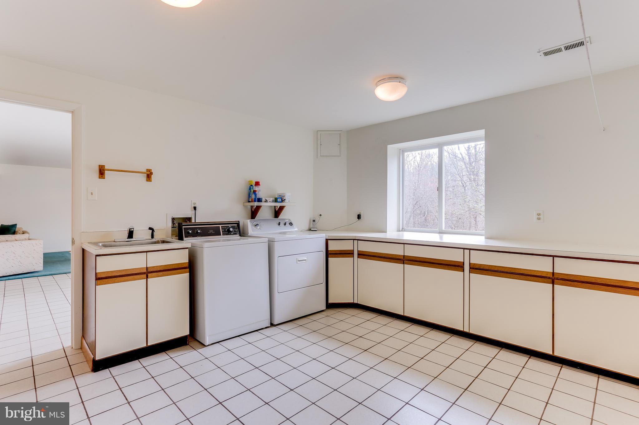 1713 Gamewell Road Silver Spring, MD 20905 - Photo 27 of 30 a kitchen with cabinets and sink