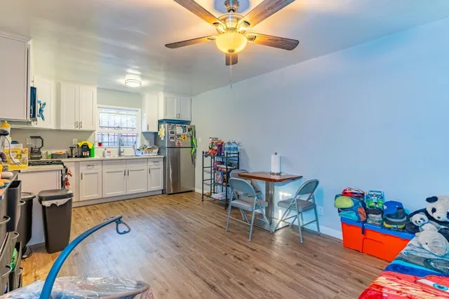a view of a kitchen with workspace and a window
