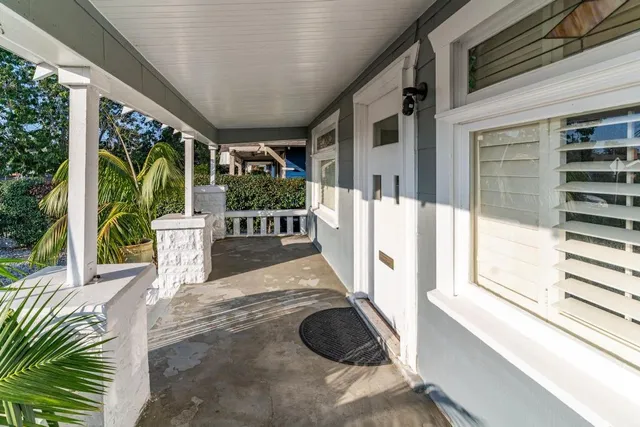 a view of balcony with furniture and garden