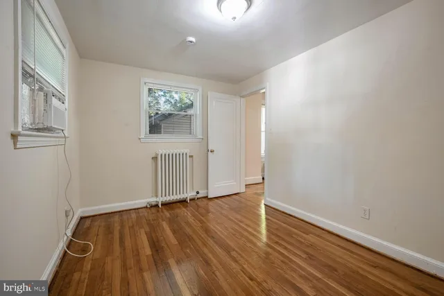 a bathroom with a sink mirror and toilet