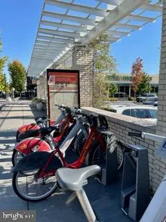 a front view of a house with a yard and tree s