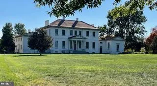 a street sign on a pole on a wall