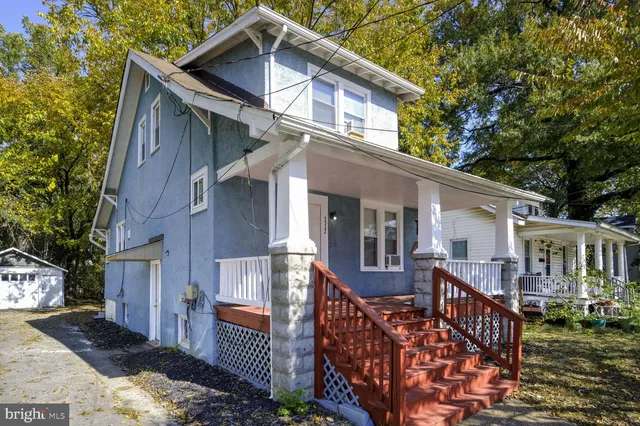 a room with wooden floor and a window