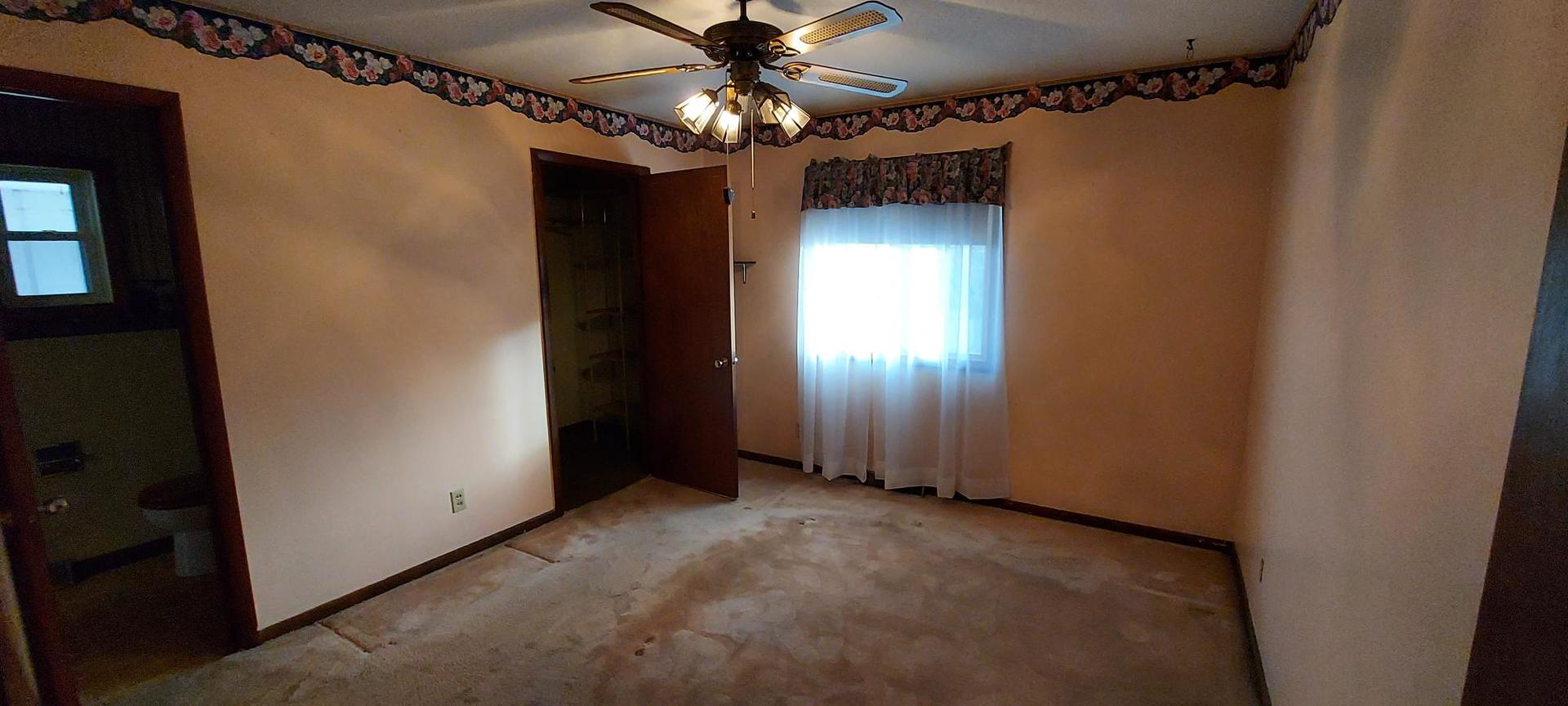 1606 20th Avenue Viola, IL 61486 - Photo 19 of 26 a view of an empty room with a window