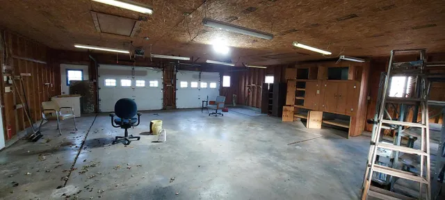 a room with lots of furniture and gym equipment