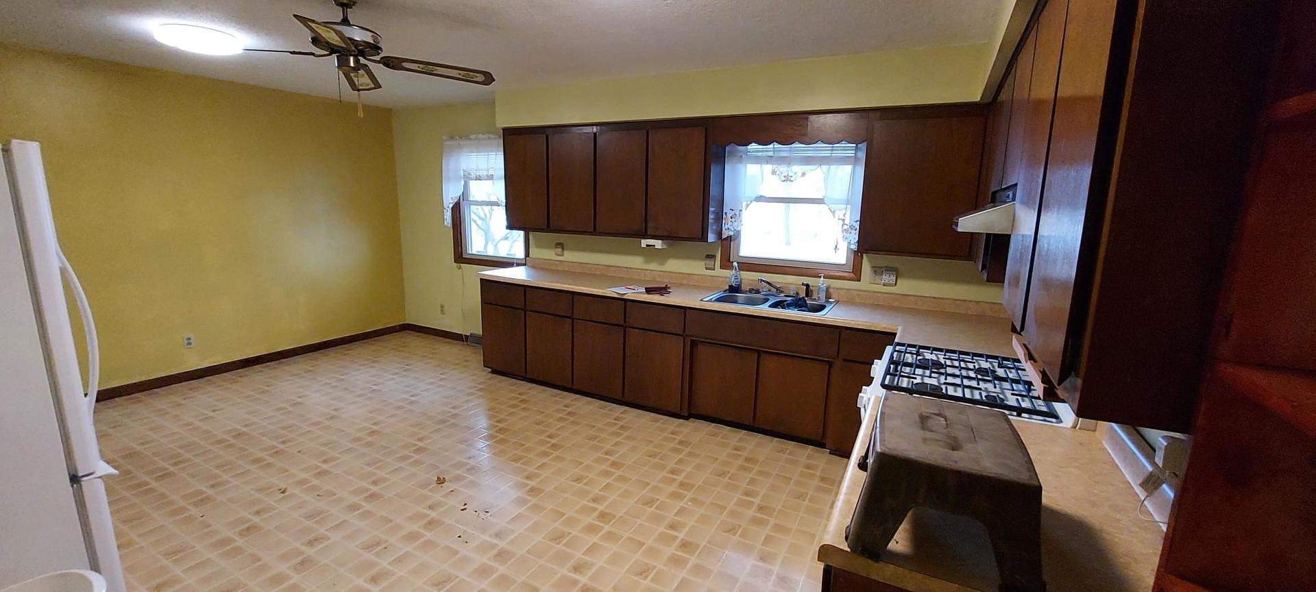 1606 20th Avenue Viola, IL 61486 - Photo 8 of 26 a view of kitchen with windows and sink