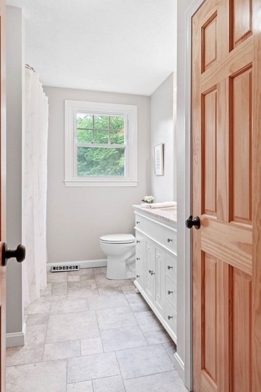10 Wyman Road Billerica, MA 01821 - Photo 14 of 33 a bathroom with a toilet a sink and a window