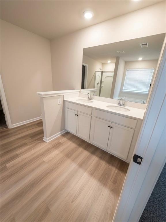 11644 Stovall Place Hampton, GA 30228 - Photo 13 of 18 a room with a sink and mirror